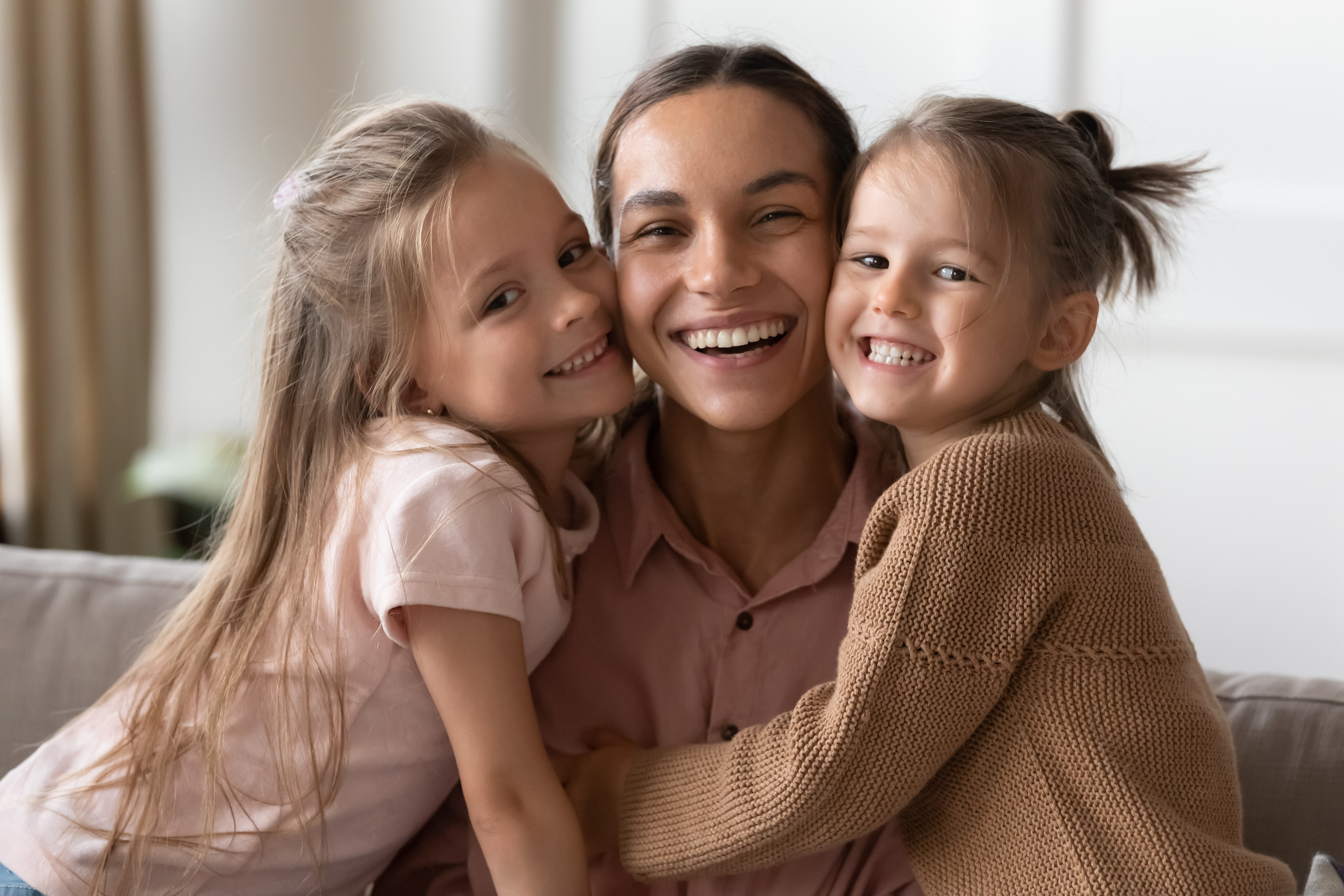 A smiling mother with her children