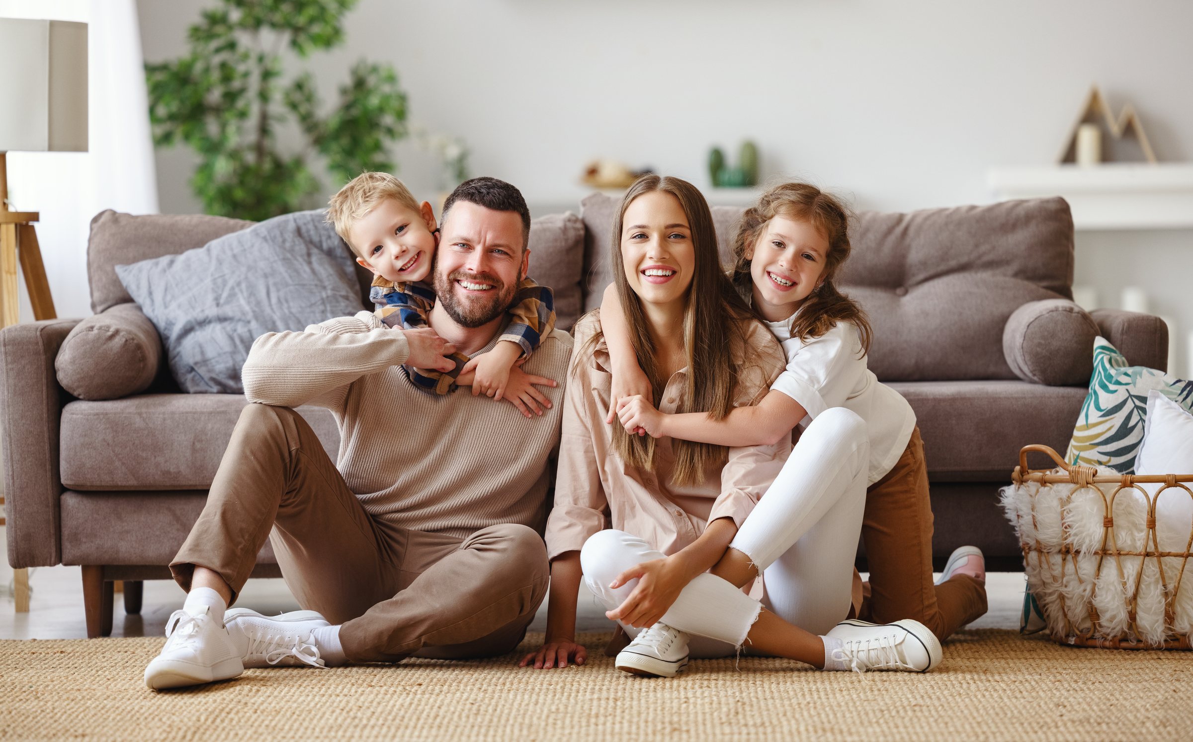 A smiling father with his children