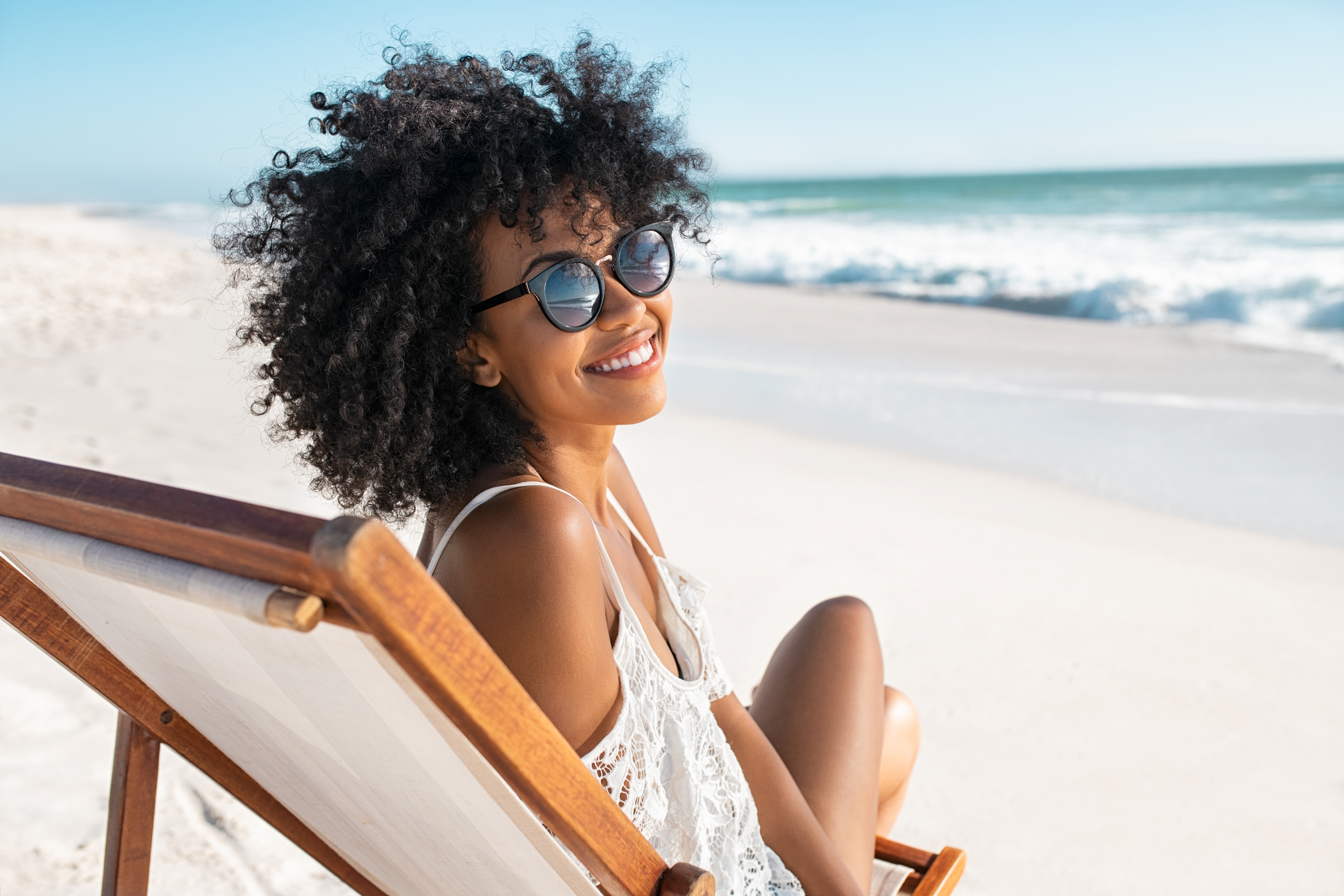 A smiling woman at the beach