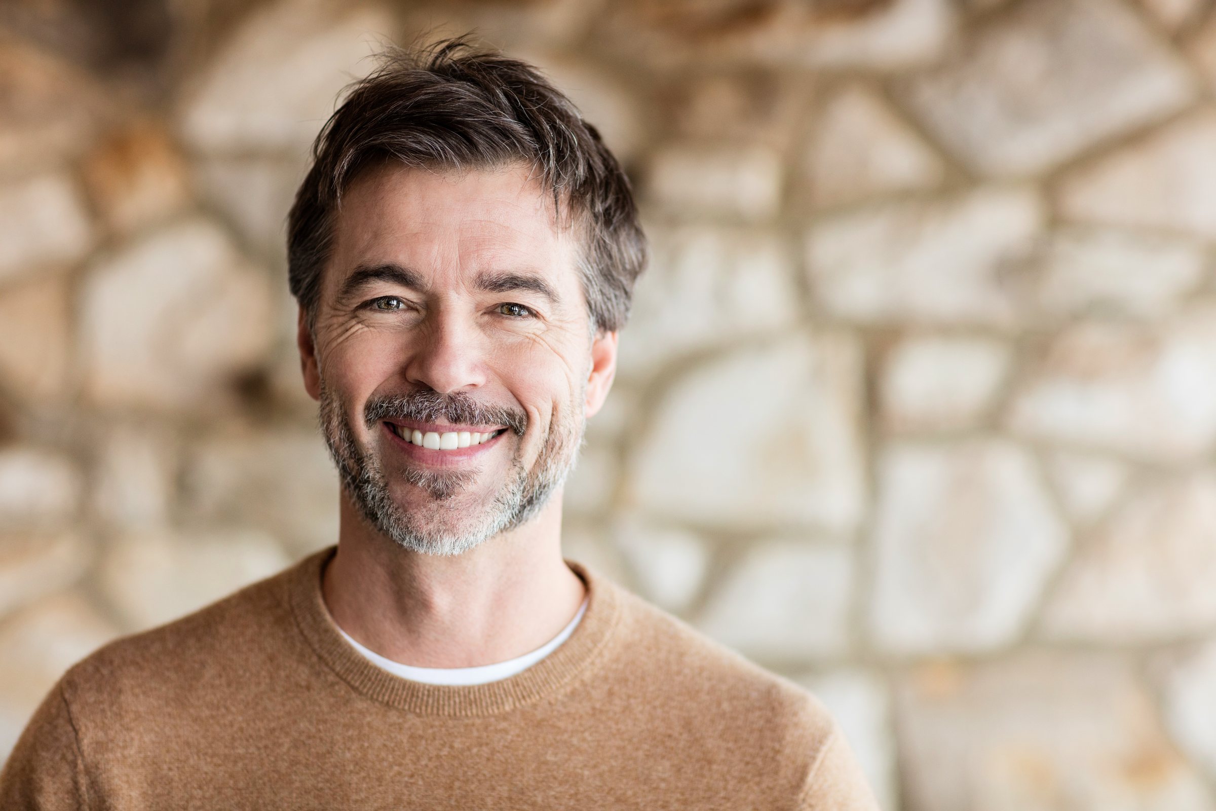 Smiling young man facing the camera