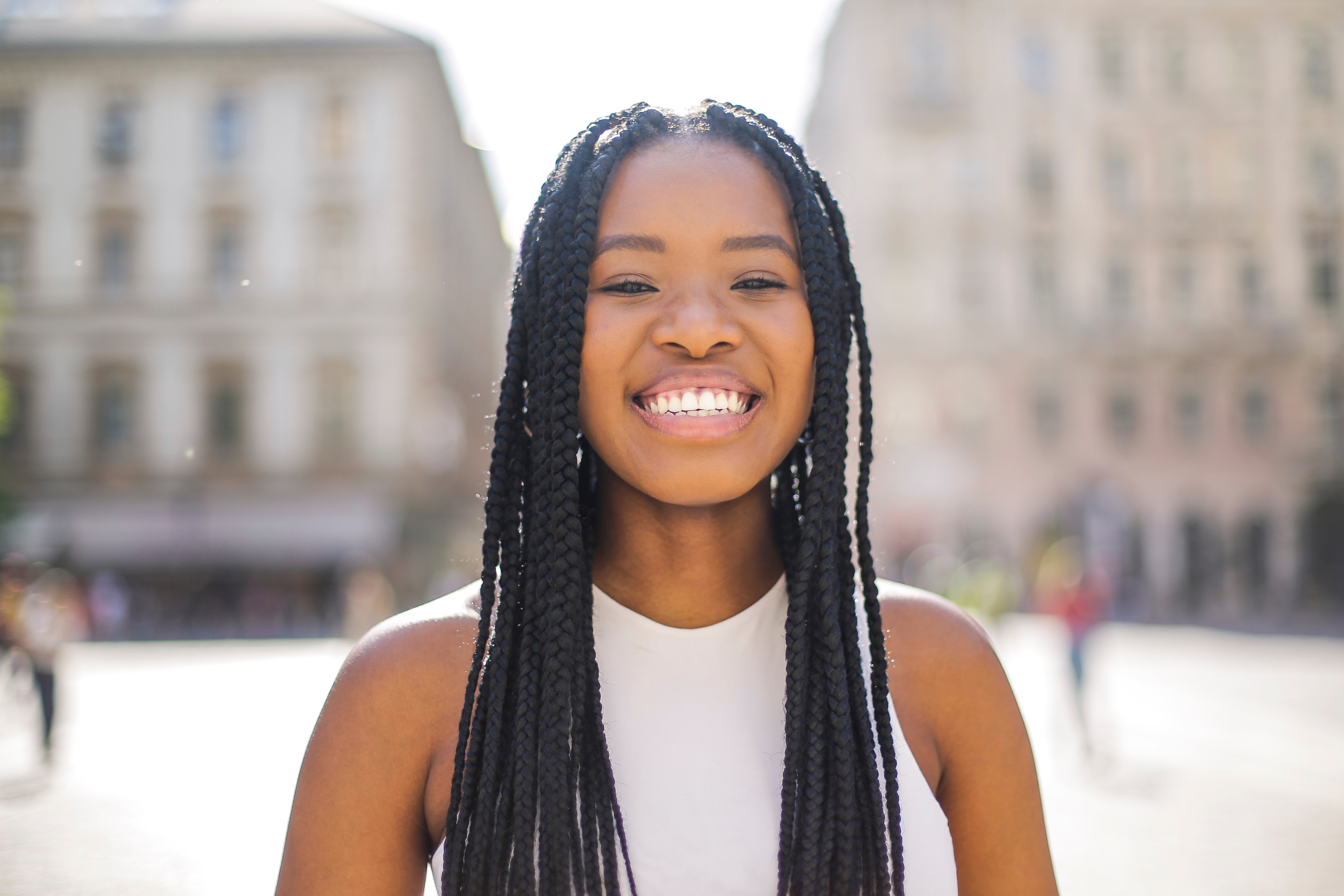 Smiling woman with long braids